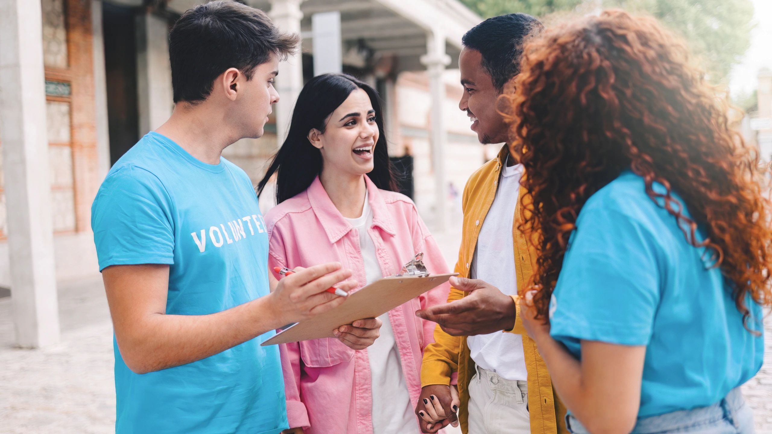 diverse volunteers helping youth urban community